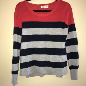 Red, navy blue, and gray striped sweater